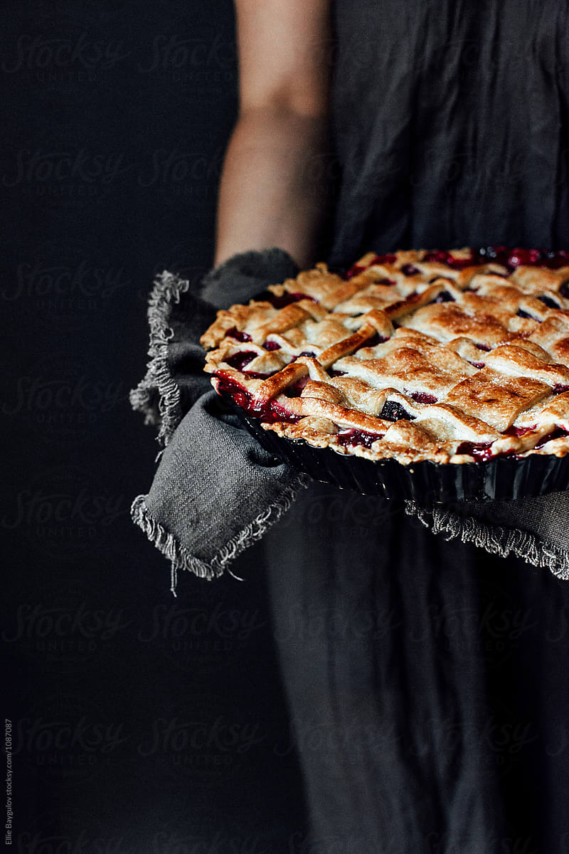 Woman holding berry pie