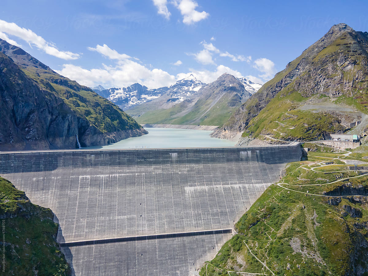 Hydroelectricity, renewable energy, big water dam in Alps mountains