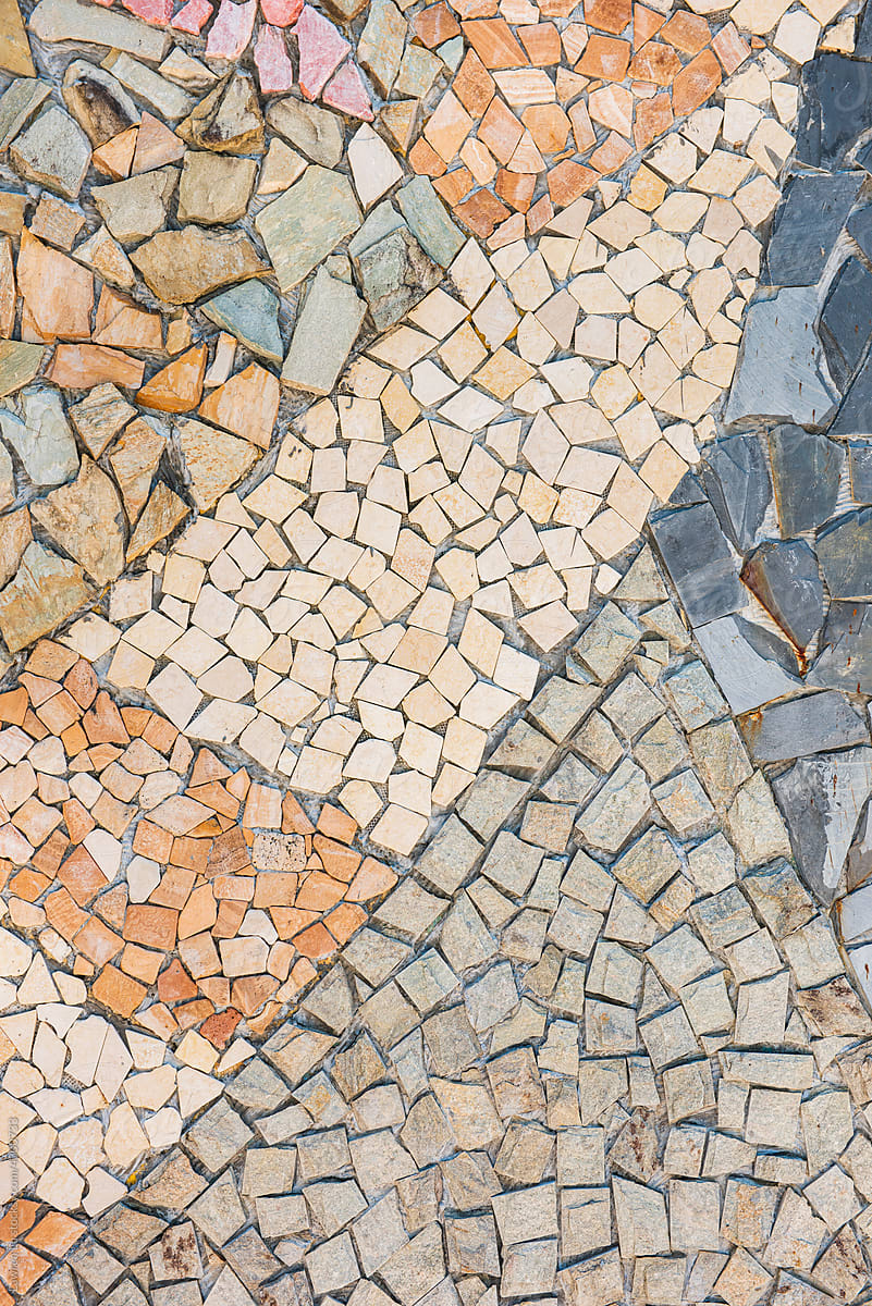 Colorful broken stone collage on ground