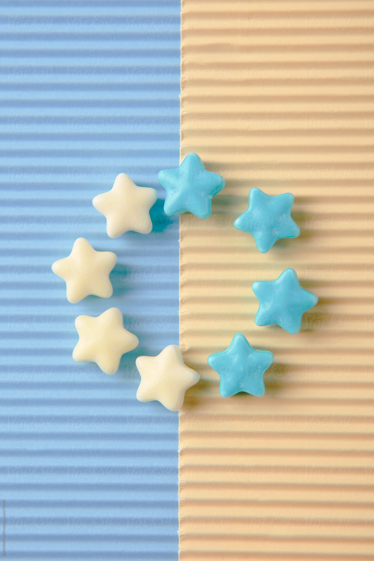 Composition with sugar candy stars. Pastel tones.