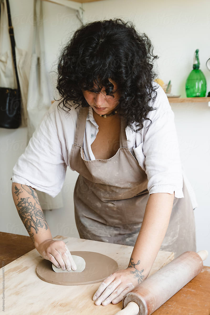 Woman making a ceramic dish