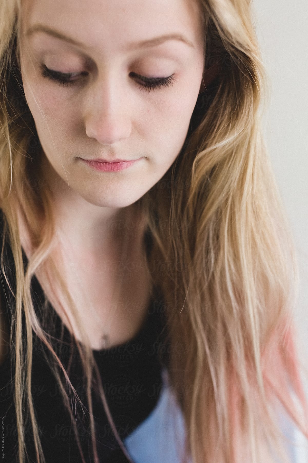 Close up portrait of a pretty young woman with long blonde hair.