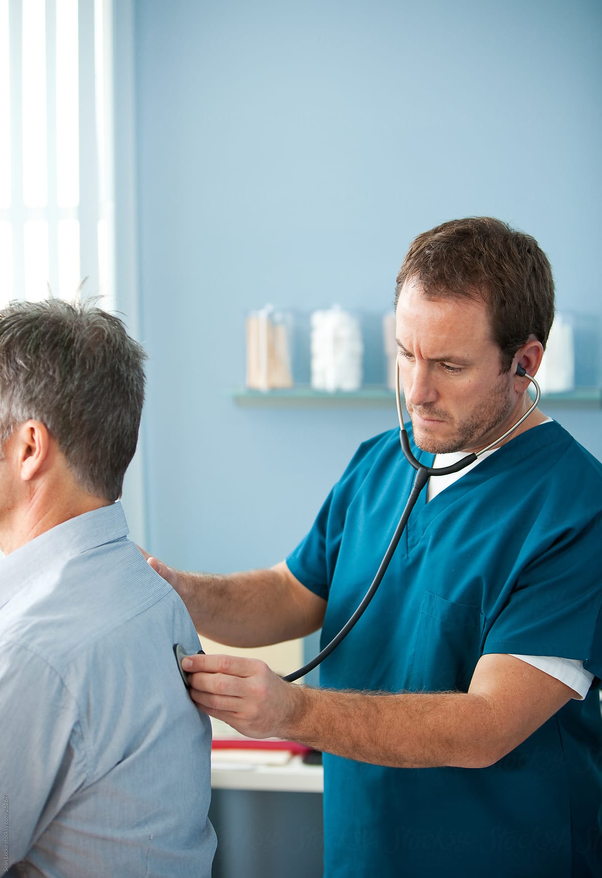 Exam Room: Male Nurse with Patient