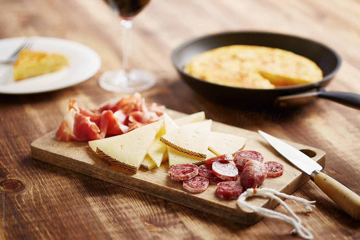 Typical spanish appetizers: jamon, cheese, dry sausages