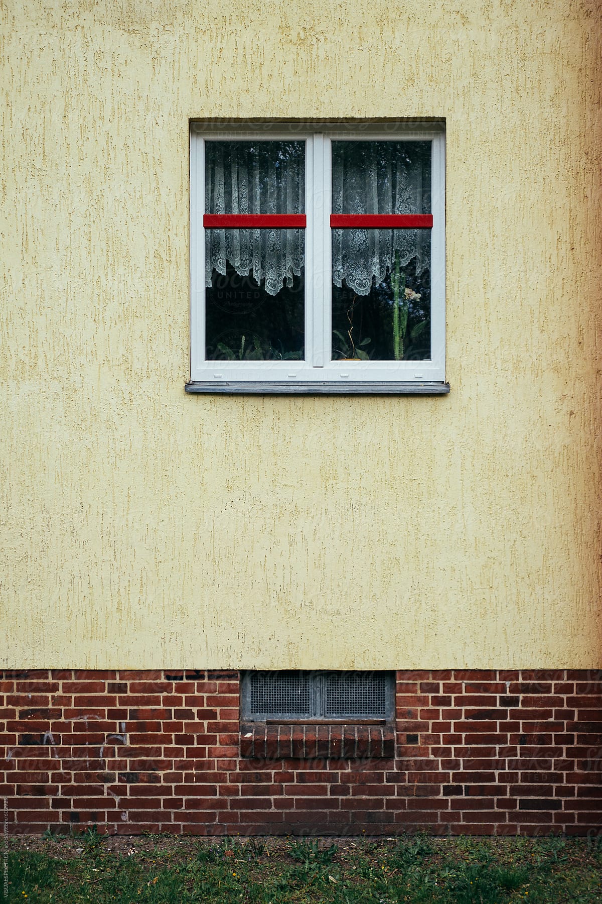 Window in Old-Fashioned Residential Building of Yellow Color