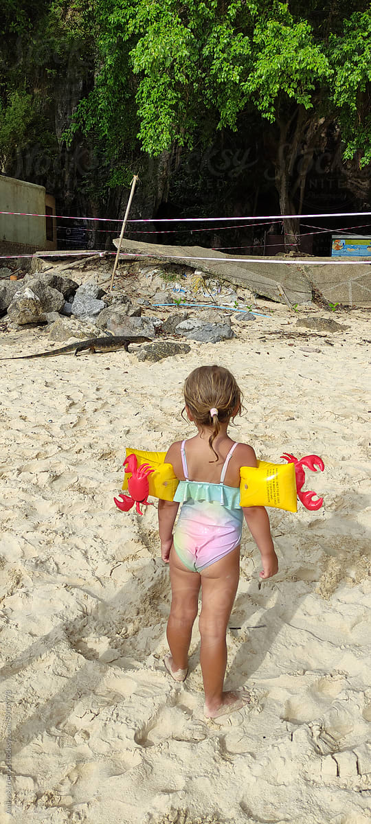 cute child enjoys sea and sand
