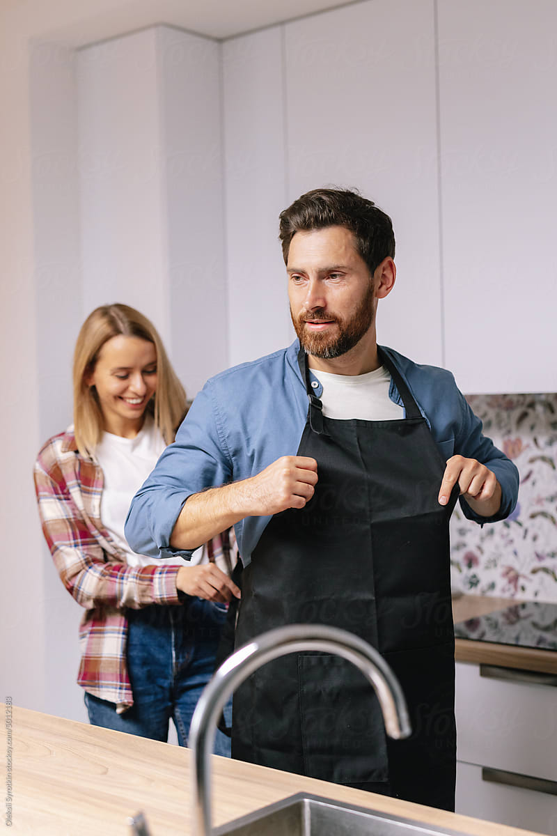 Chef tying apron help  partner relationship kitchen