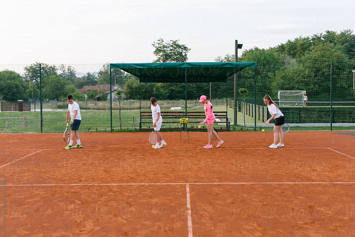 Kids at tennis practice outdoor