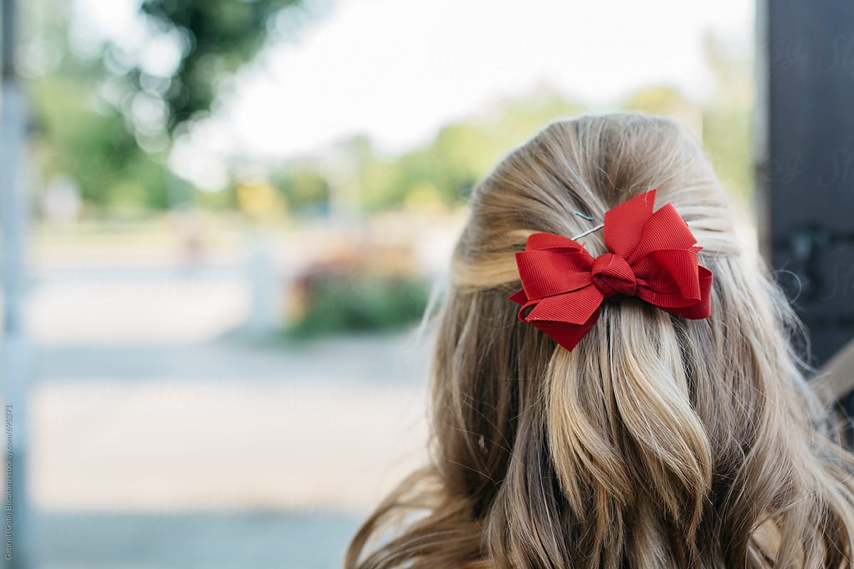 Blonde Girl With Red Ribbon In Her Hair by Stocksy Contributor Gabi  Bucataru - Stocksy