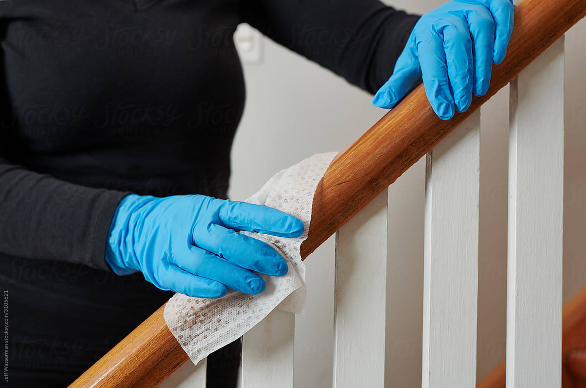 Wiping Bannister in House for Virus