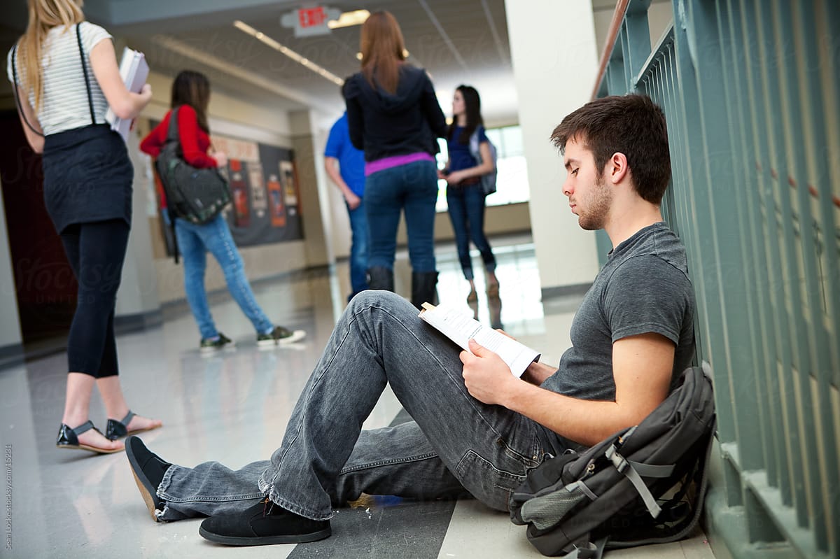 High School: Guy Sits on Floor to Review for Test