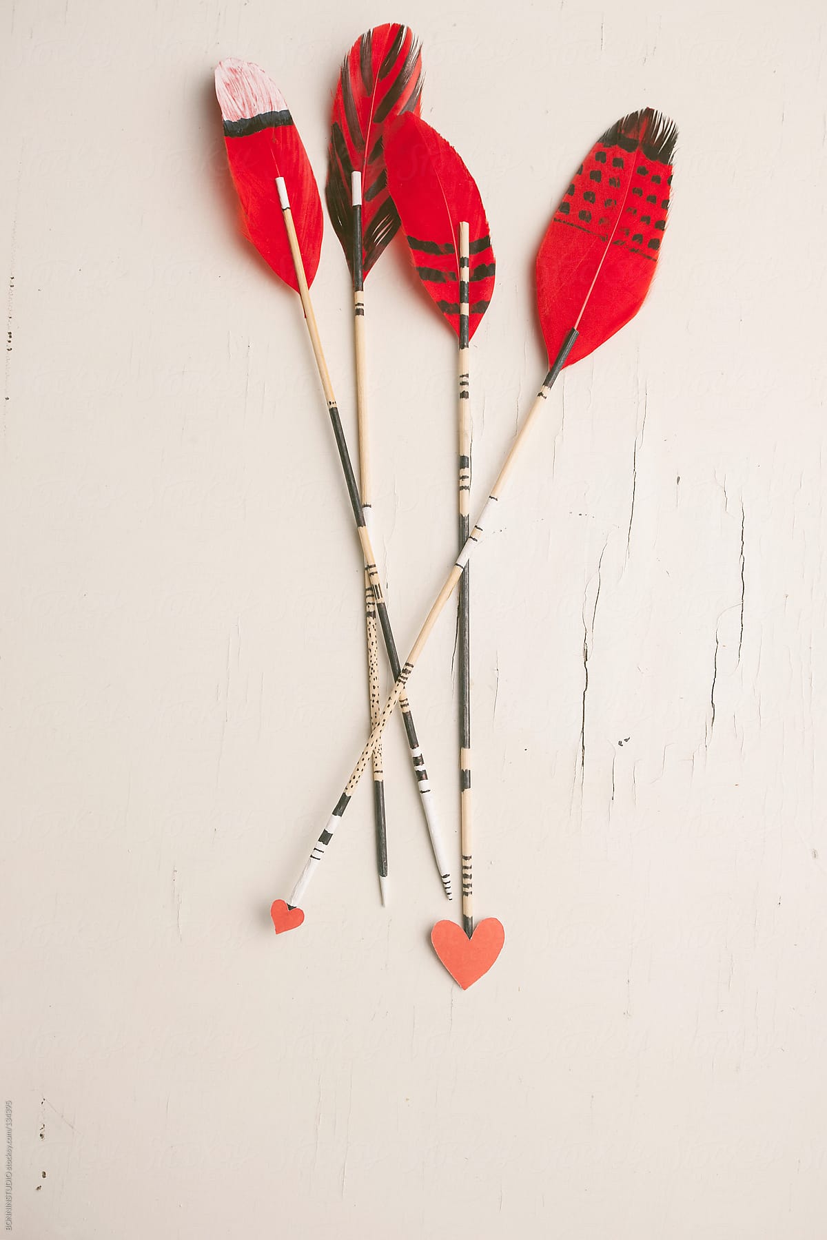 Hipster arrows with red feathers and hearts. Valentine\'s day.