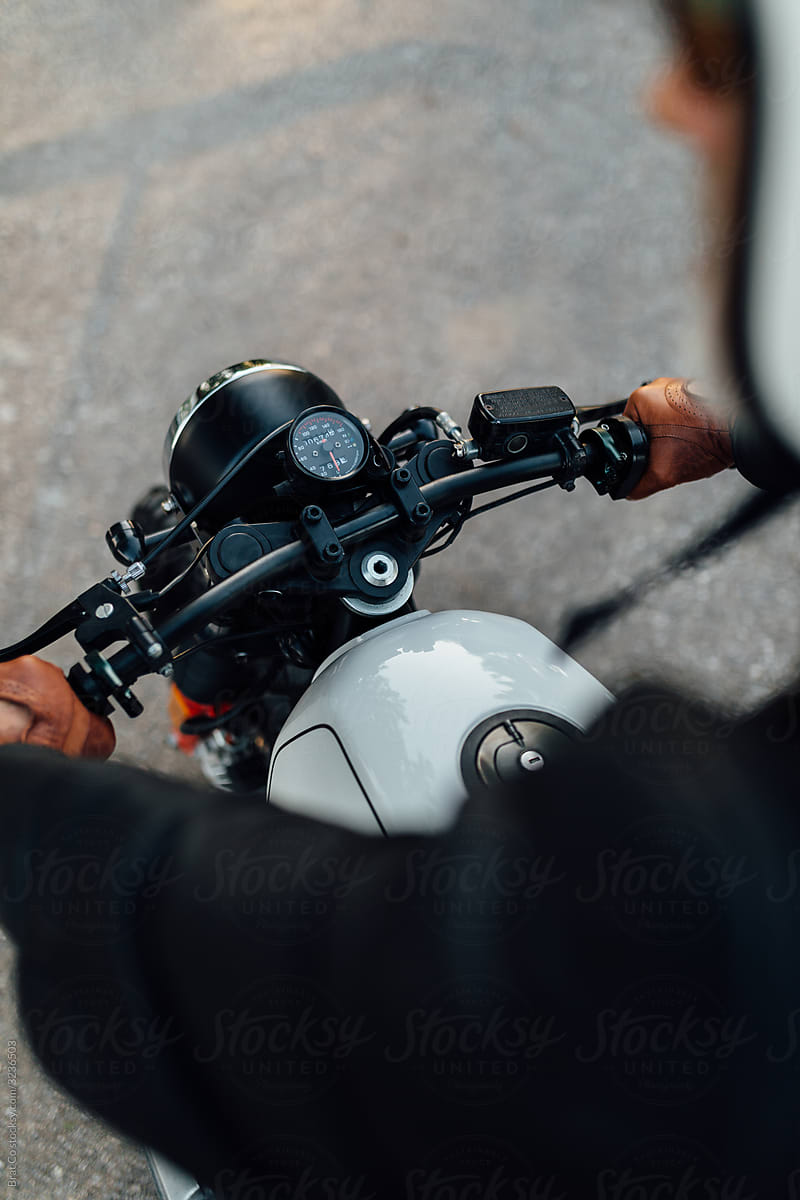 Man\'s Hands on Motorcycle Handlebars
