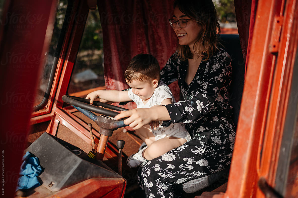 Woman with son in tractor