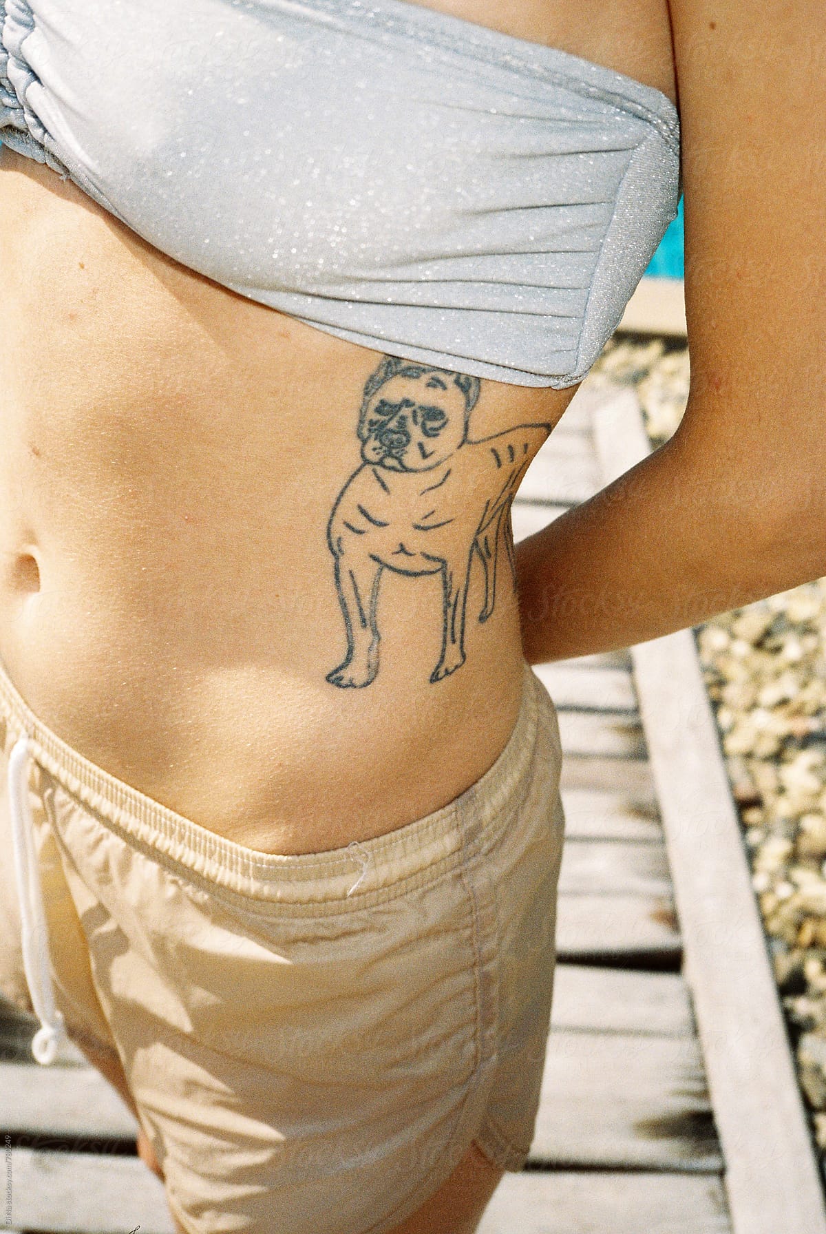 Young girl with a dog tattoo on her body