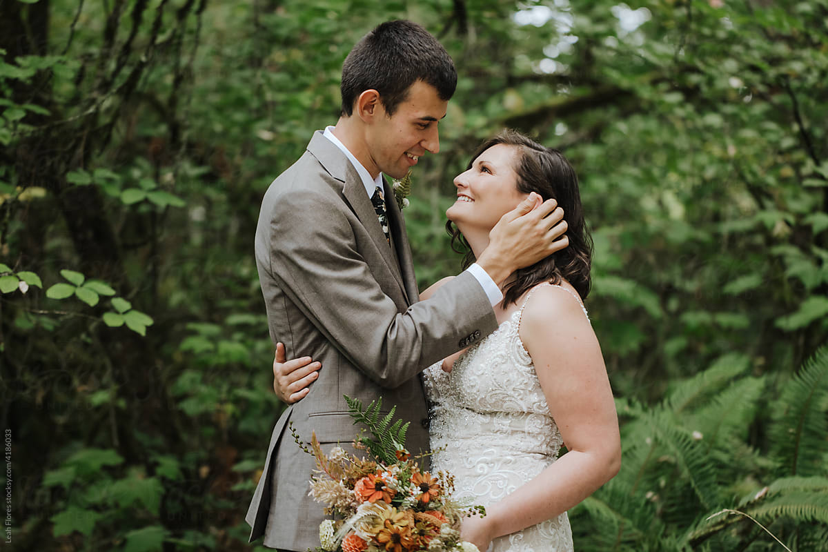 Affectionate Bride and Groom in Forest