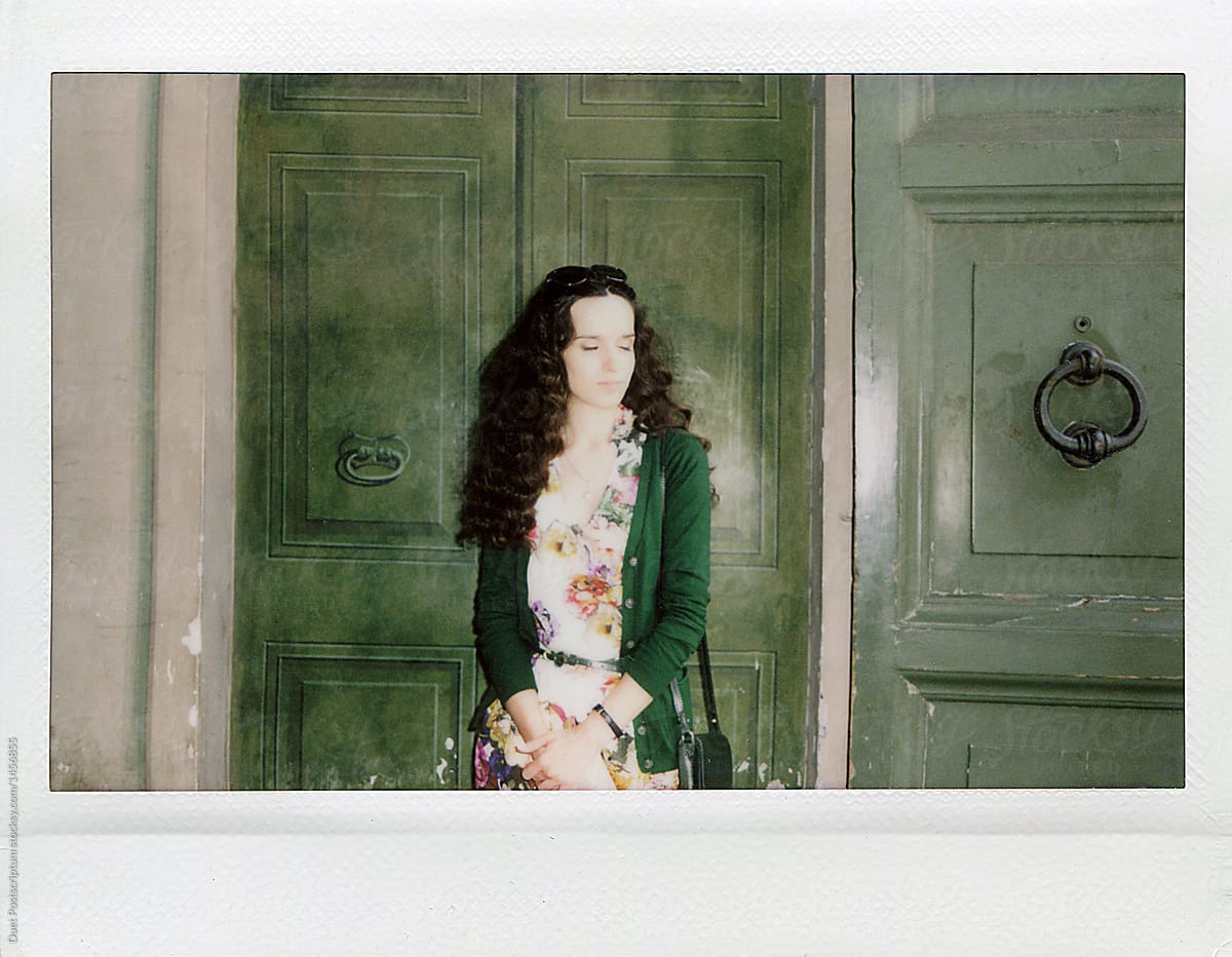 Girl on the background of the green door