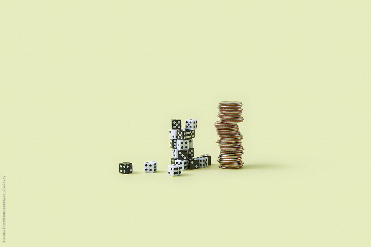 Two stacks of black and white dice and coins.