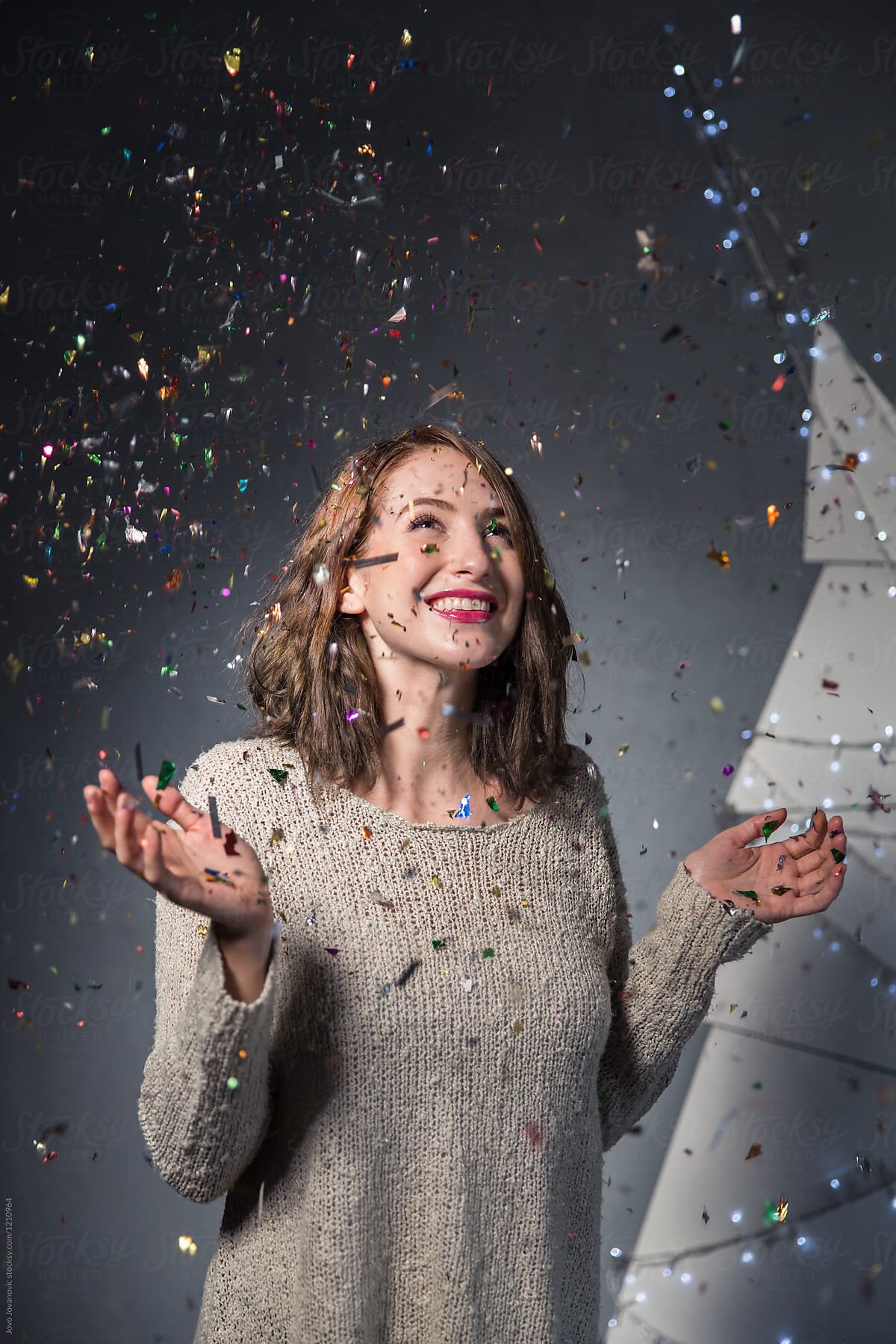 Young Woman Feels Happy while Confetti Falls