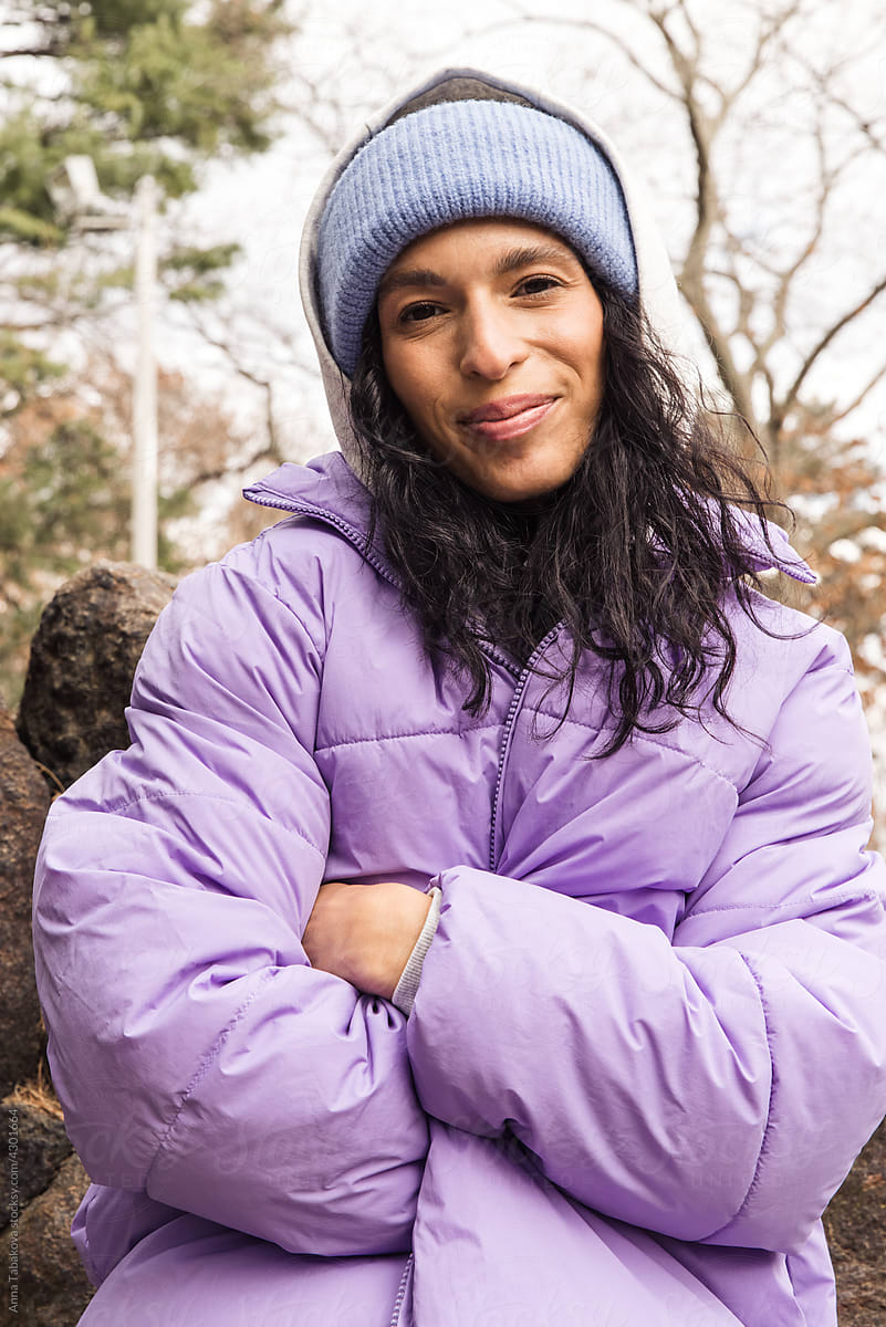 Model wearing winter beanie and puffer