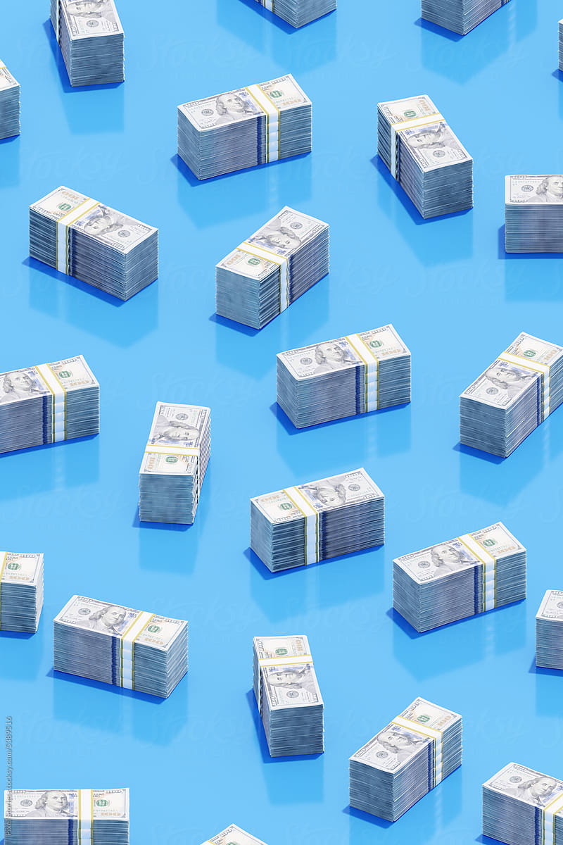 Hundred US dollars money bundles on blue background