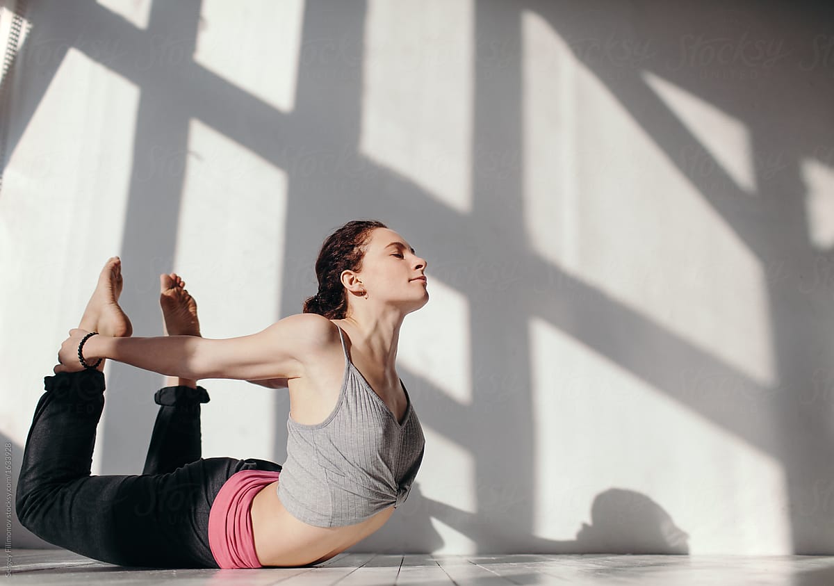 Flexible Woman In Yoga Pose By Stocksy Contributor Sergey Filimonov