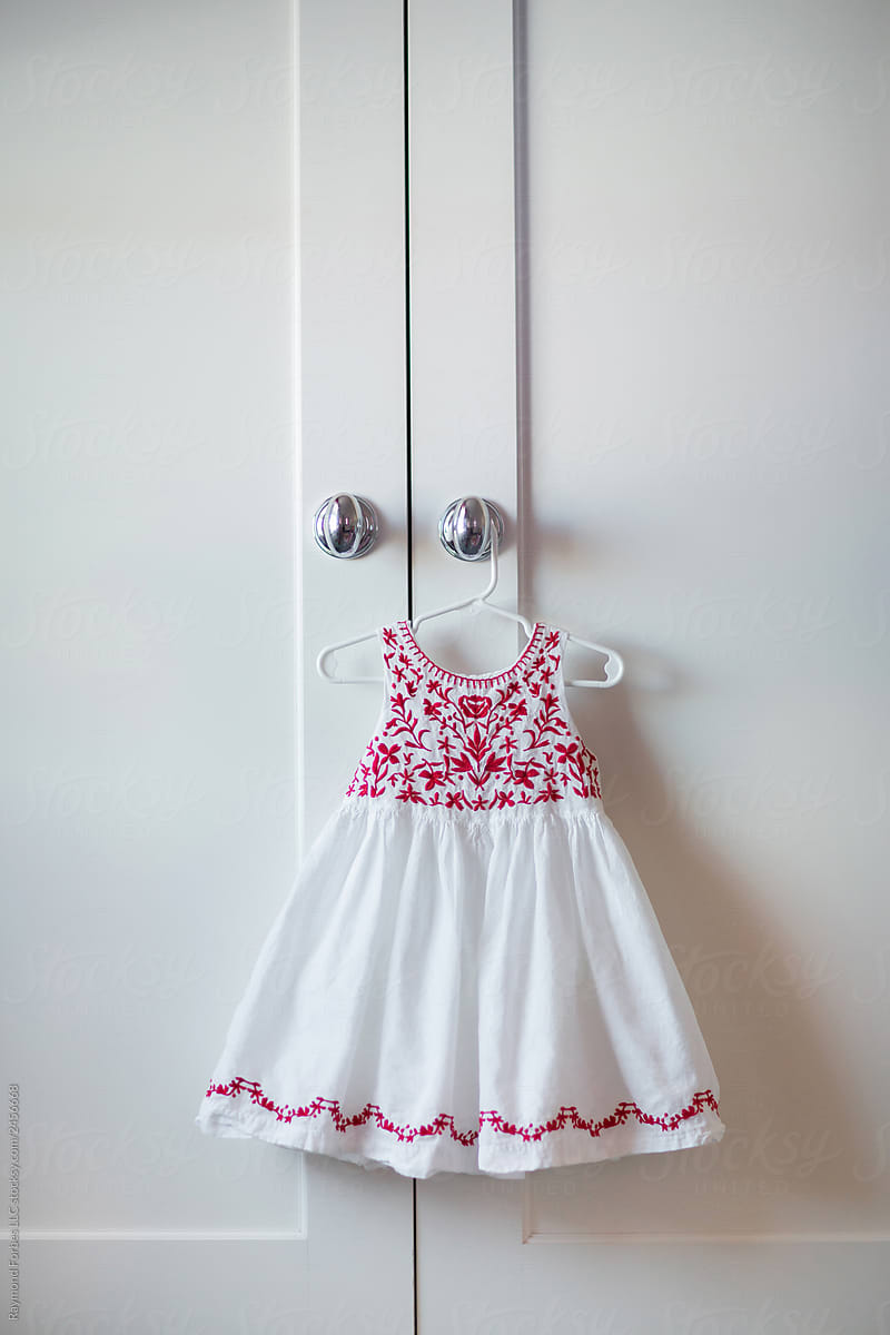 Summer Dress of a little girl Hanging in the Closet
