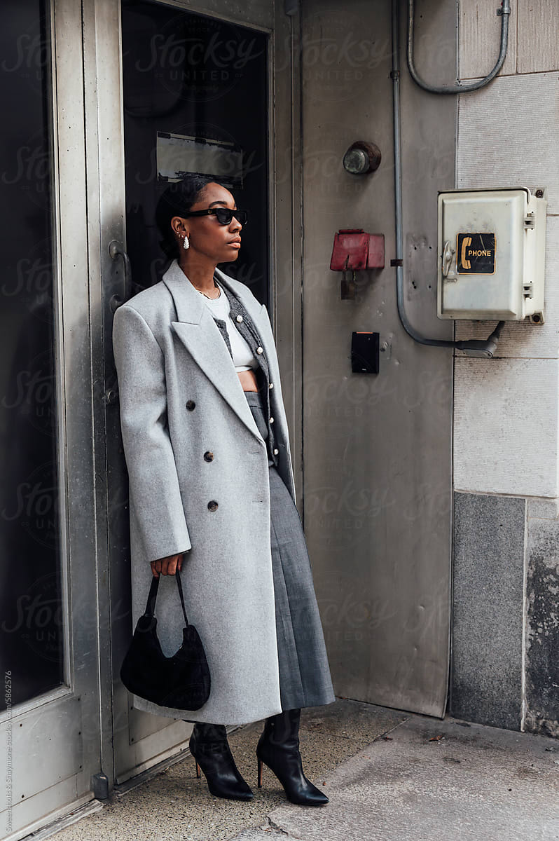 Woman wearing grey downtown
