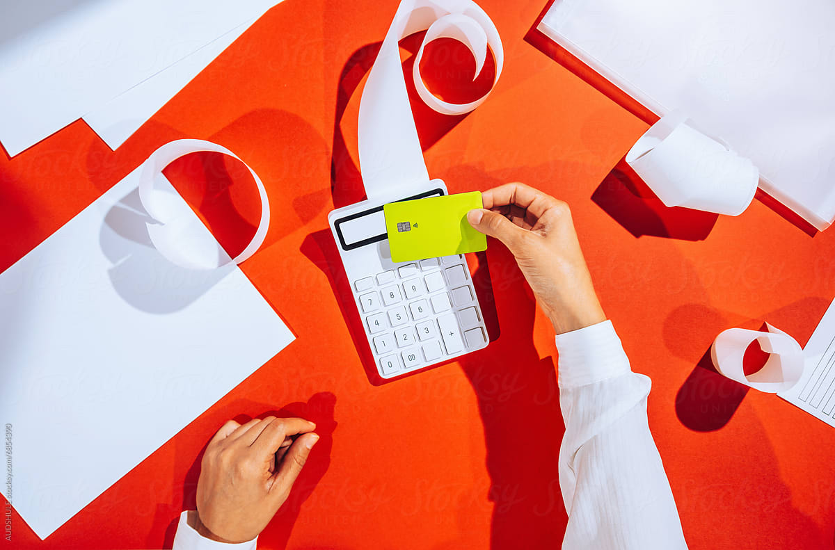 "Paying with credit card" by Stocksy Contributor "AUDSHULE"