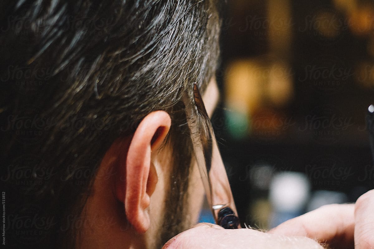 "Barber Cuts Young Male Hair" by Stocksy Contributor "Jesse Morrow