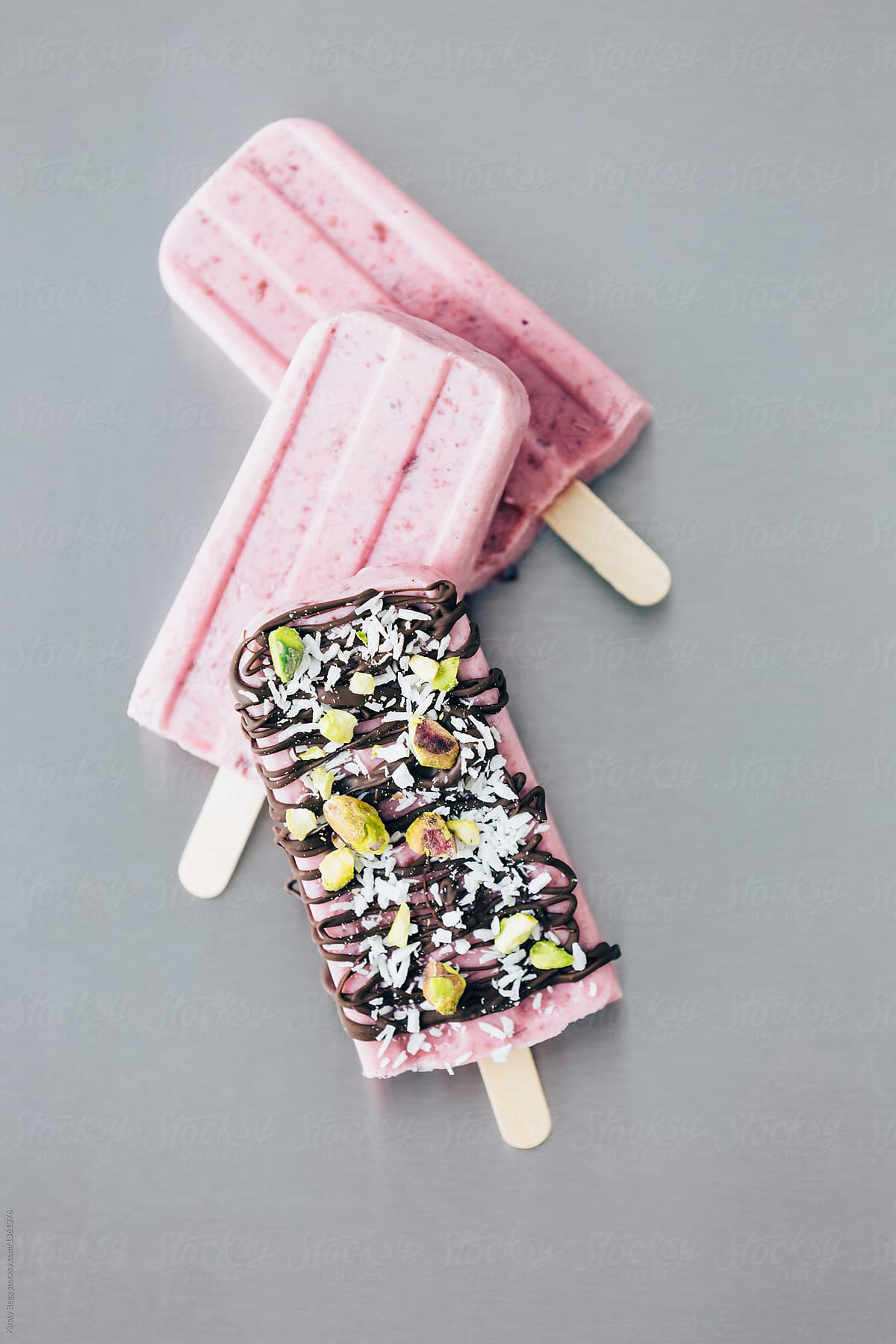 Decorated cherry ice popsicle lolly with chocolate and coconut