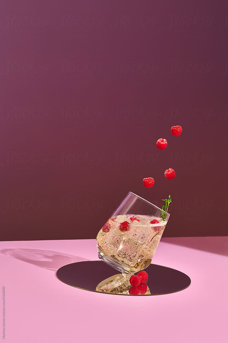 Raspberry cocktail with flying fruit
