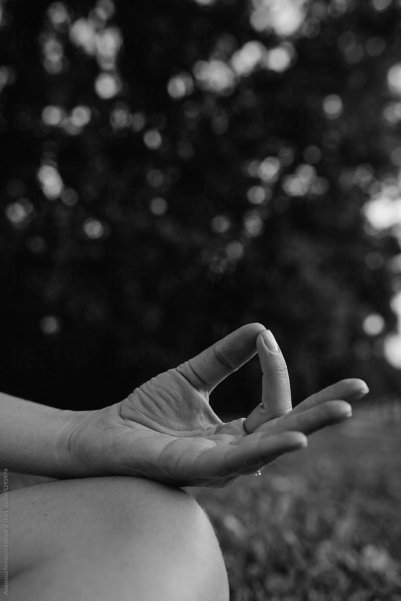 Woman's Hands In Meditation Sitting In Lotus Position