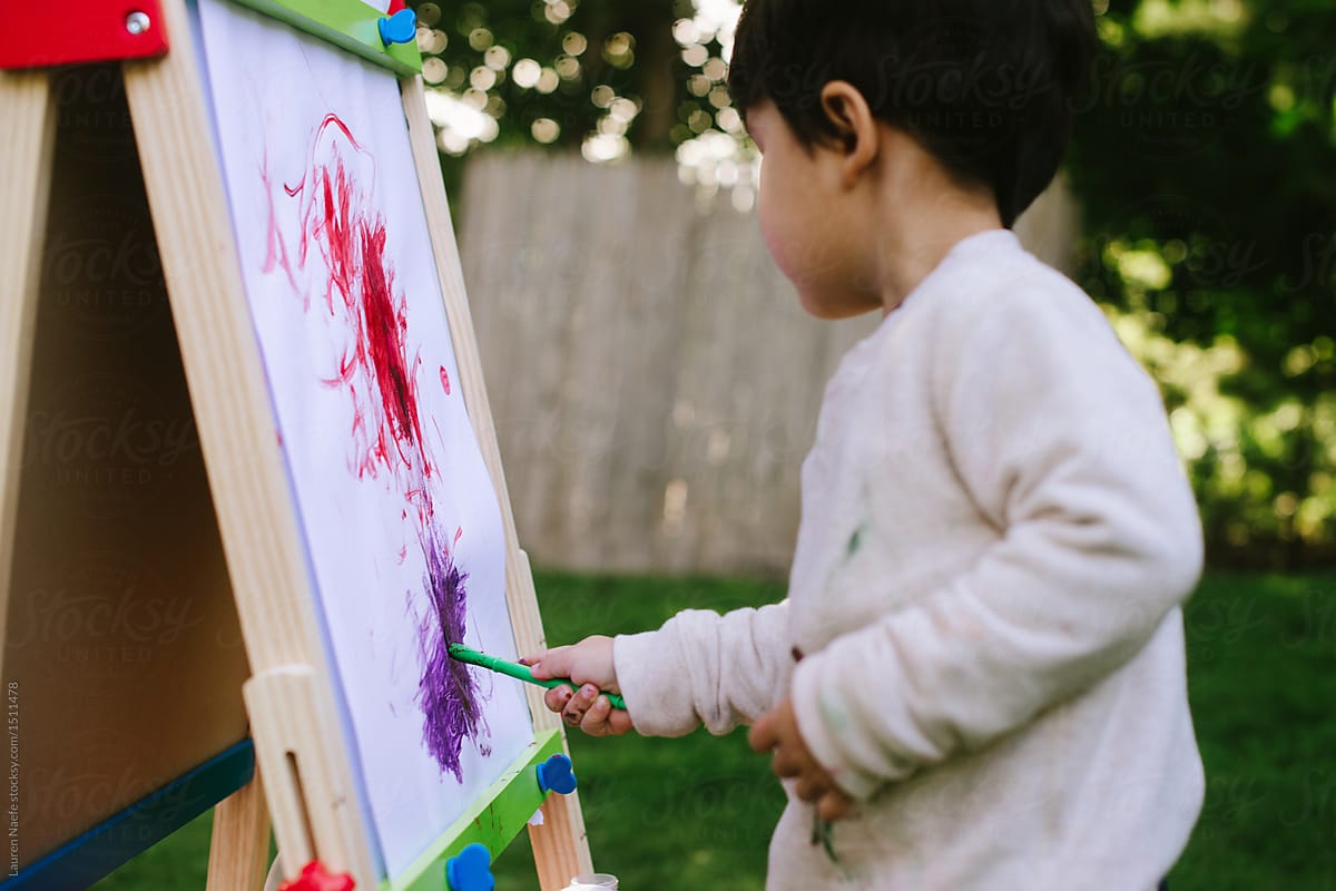 Child being creative painting