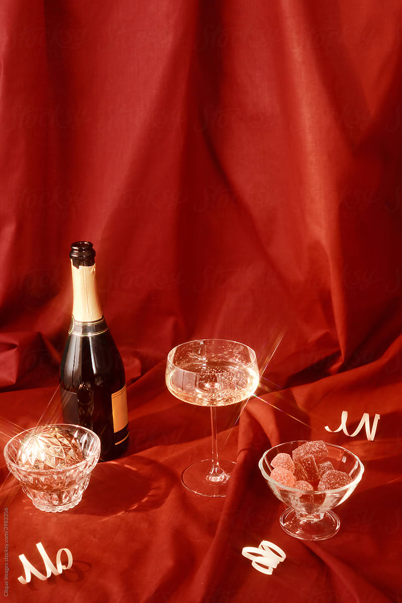 Champagne and marmalade on red fabric