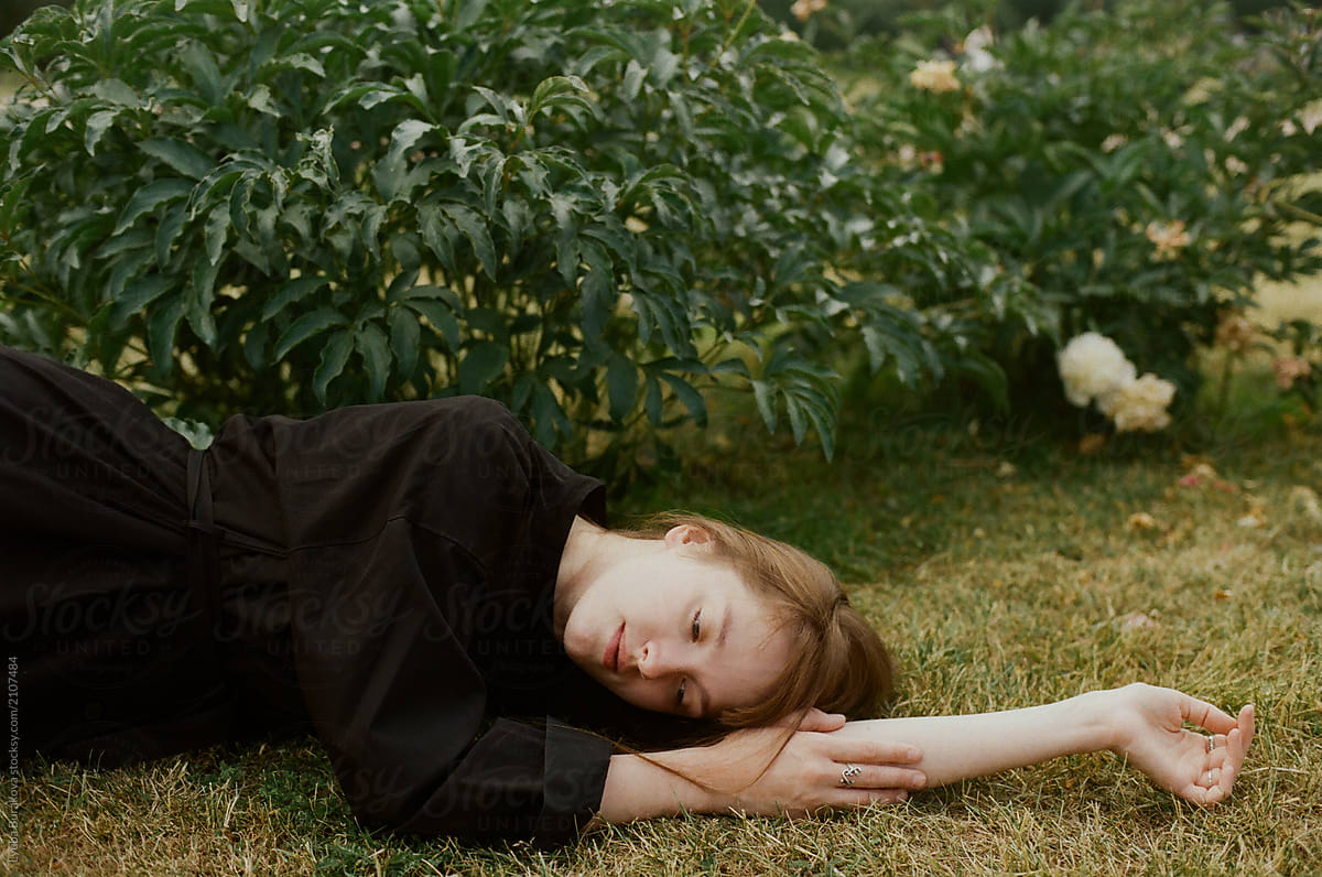 Girl Lying On A Grass By Stocksy Contributor Amor Burakova Stocksy