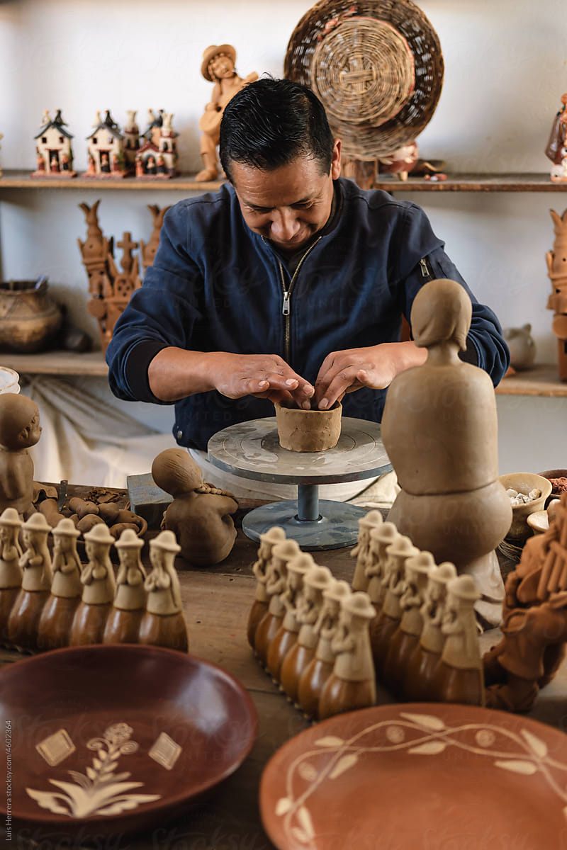 Artisan working with clay