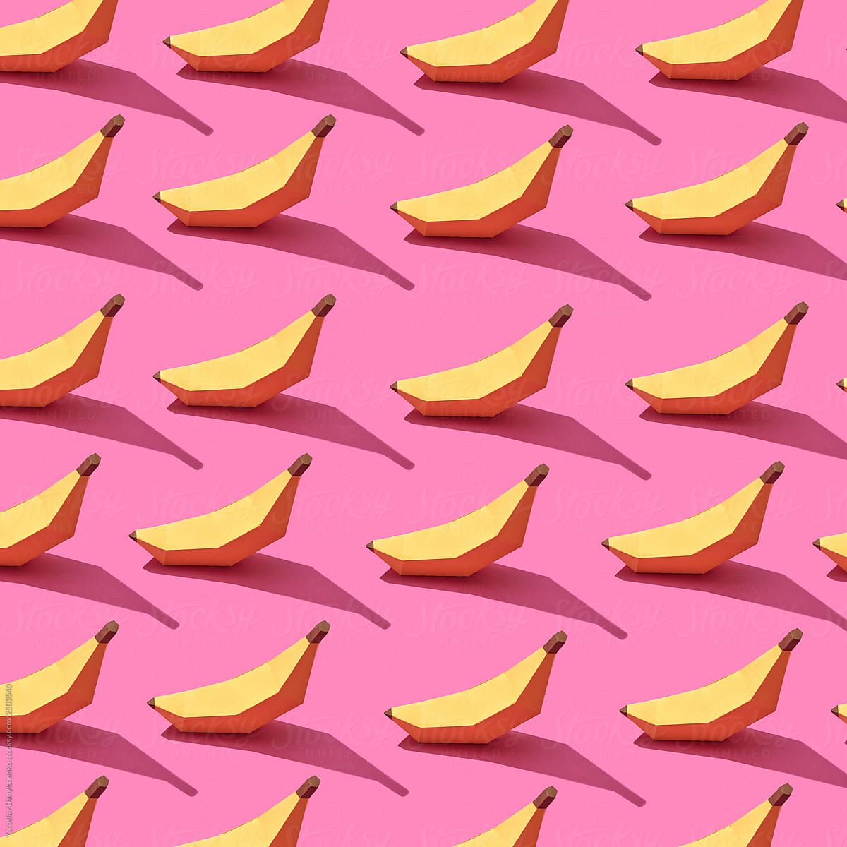 Handcraft paper bananas on a pink background