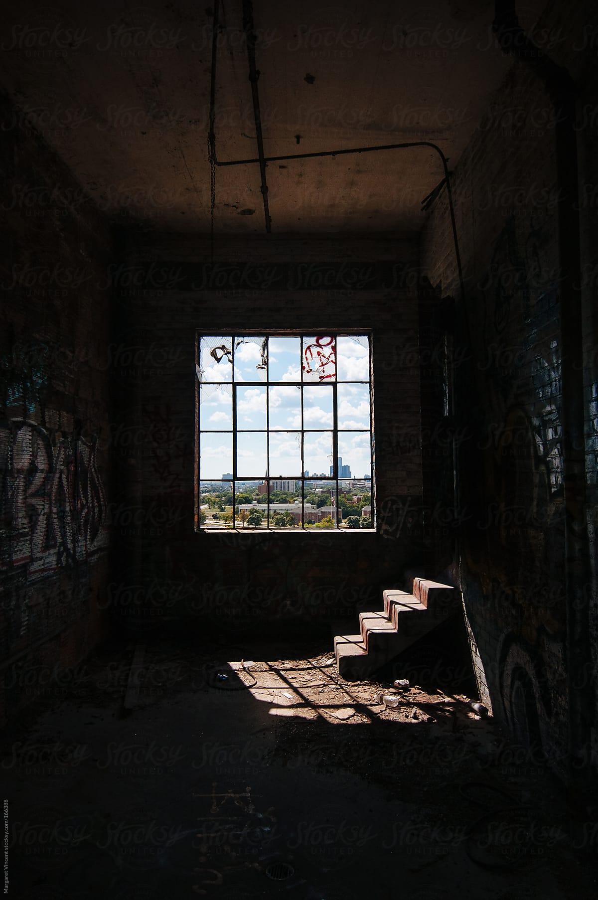 window and stairs in abandoned factory