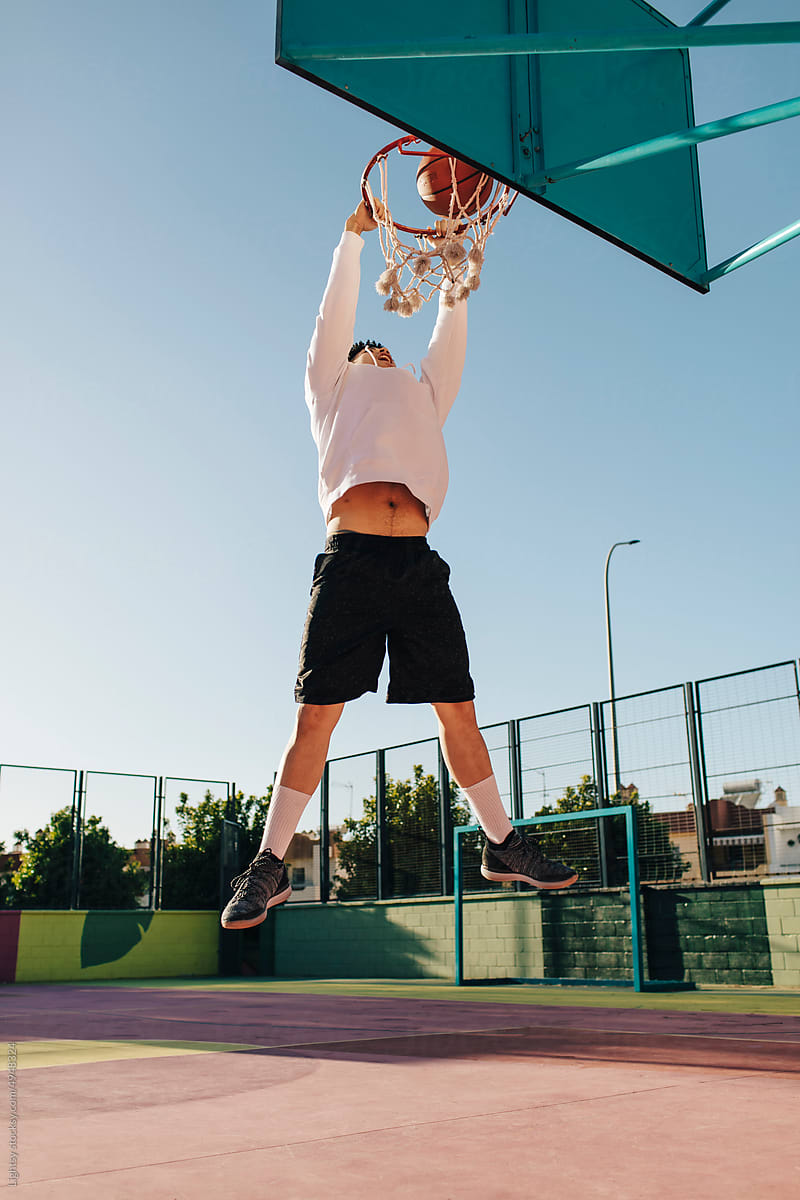 Basketball player jumping to score a basket