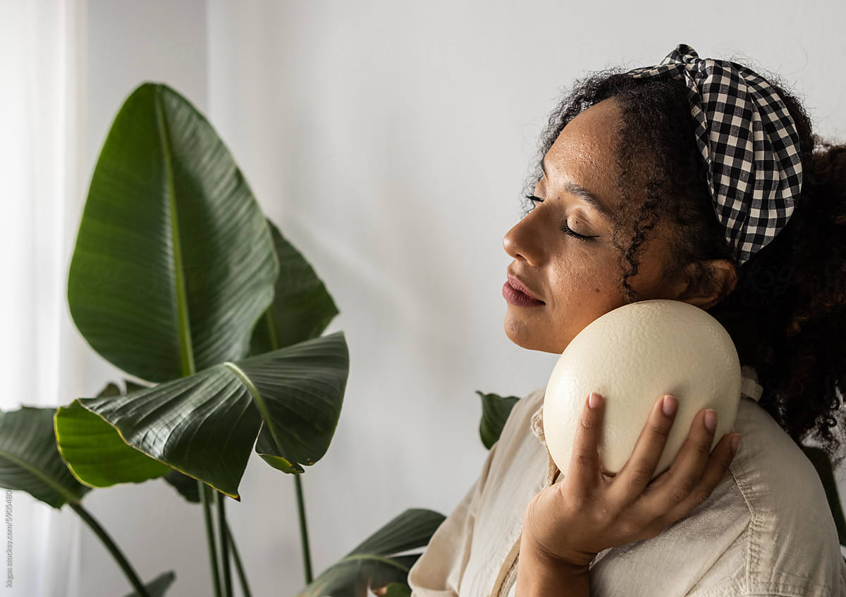 Woman with Ostrich egg, symbol of prosperity