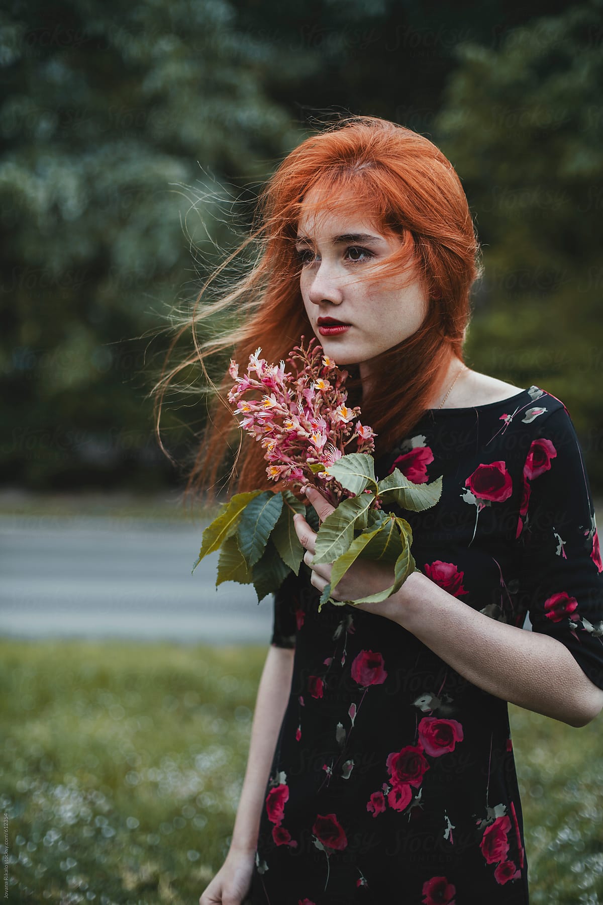 Portrait Of A Ginger Haired Woman Holding Flowers By Jovana Rikalo 