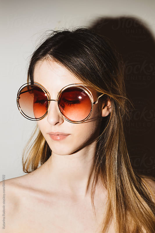 Portrait of a Pretty Young Woman With Retro Sunglasses by Katarina ...