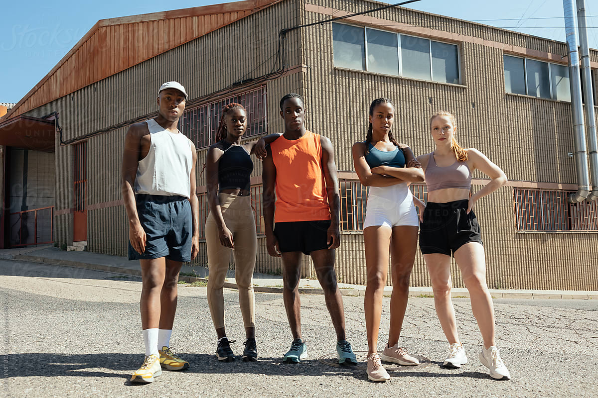Confident multiracial athletes after workout