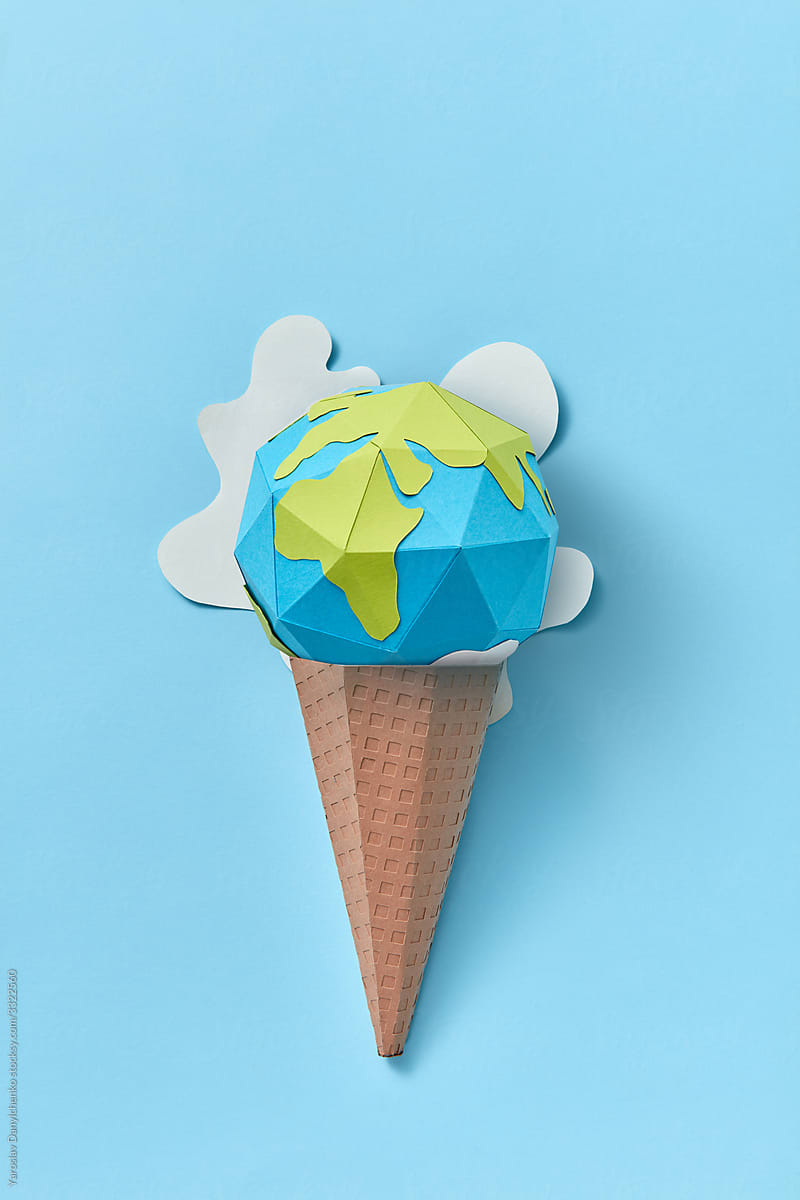Ice cream cone with melting papercraft Earth\'s globe.