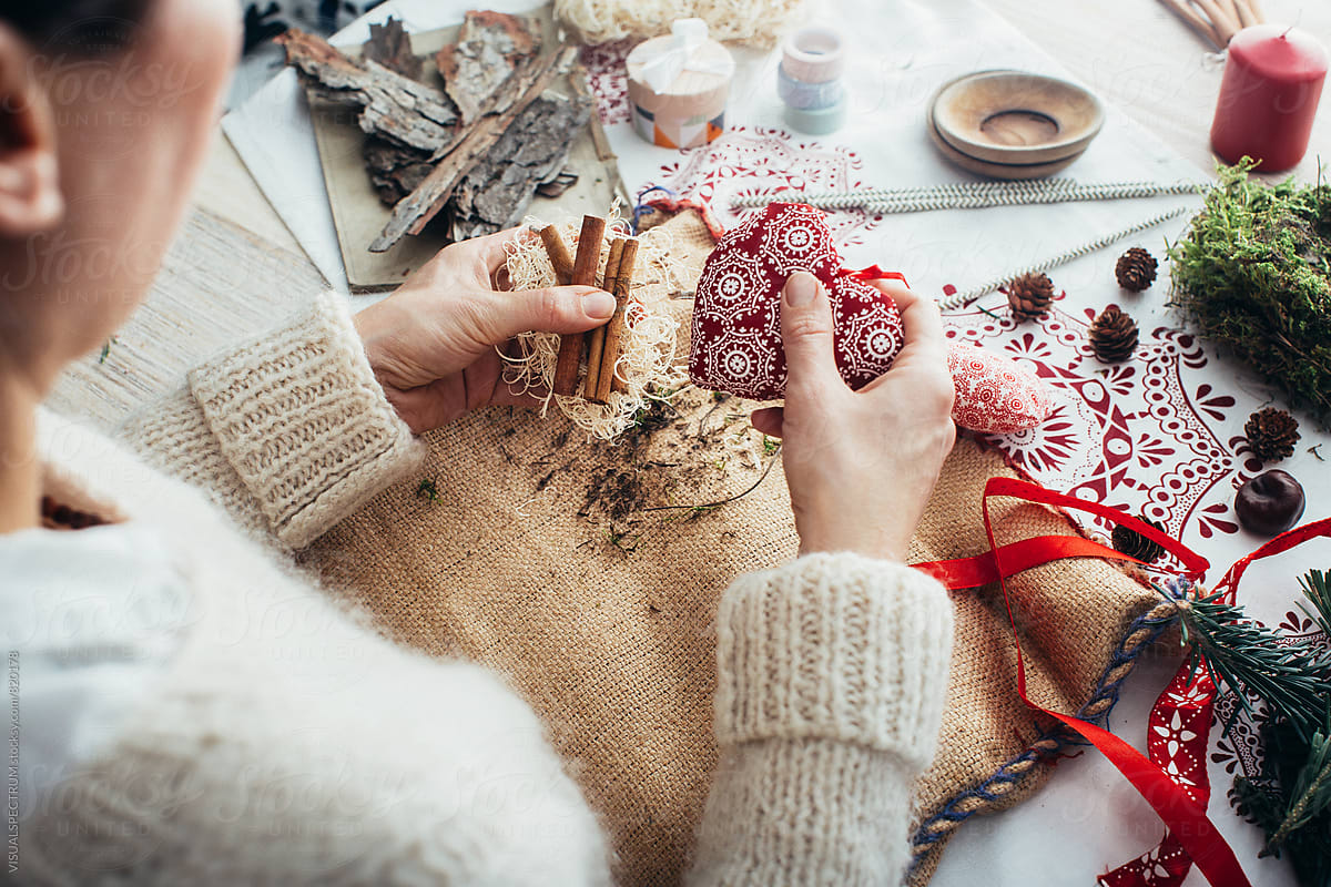 DIY Christmas - Close Up of Caucasian Woman Holding Items for Self-Made Christmas Present