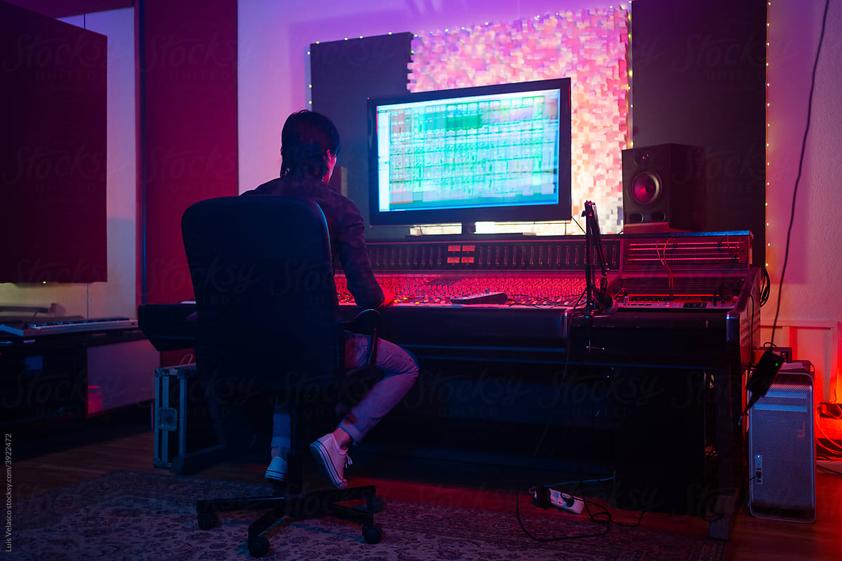 Music Producer Working With A Mixer Sound Software In The Studio.