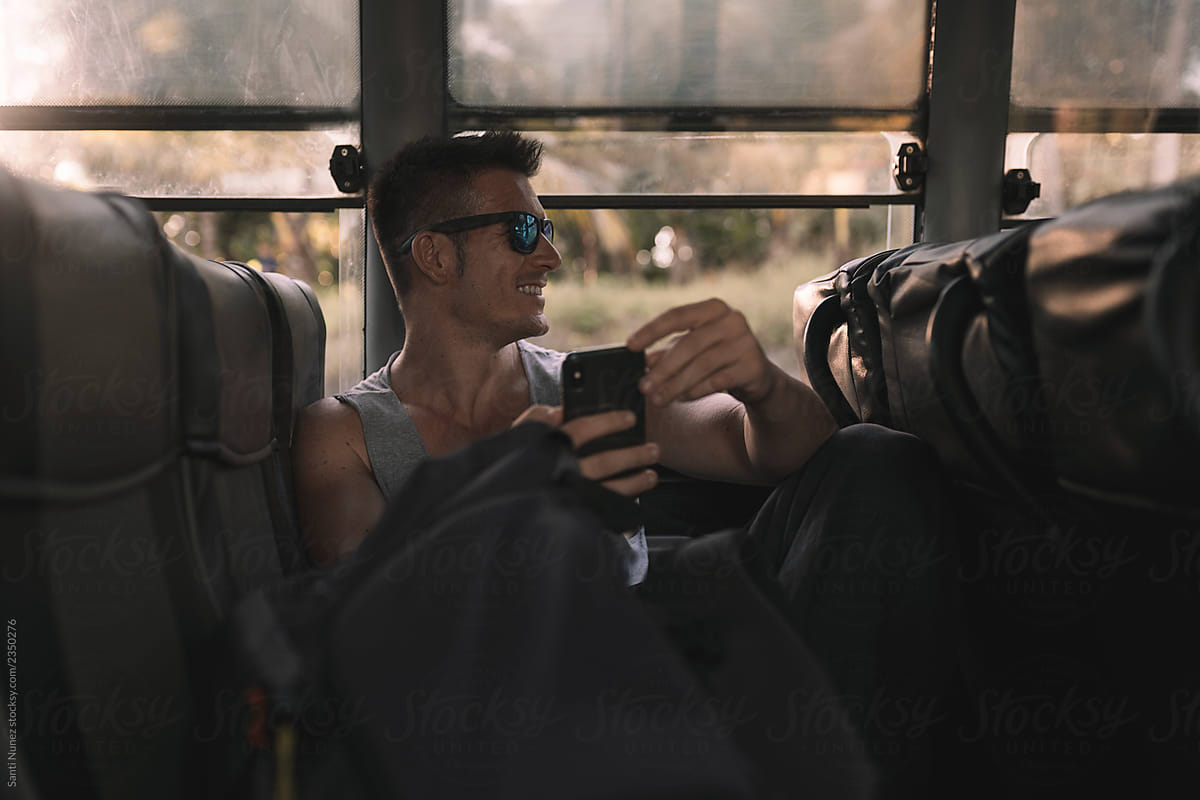Handsome Backpacker Traveling In A Bus Del Colaborador De Stocksy Santi Nuñez Stocksy