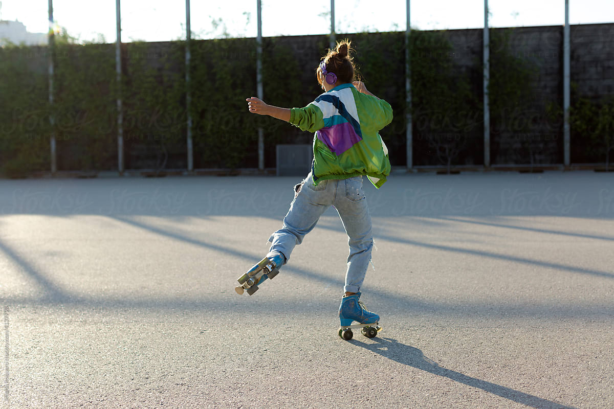 girl in roller skates practicing in morning sunlight
