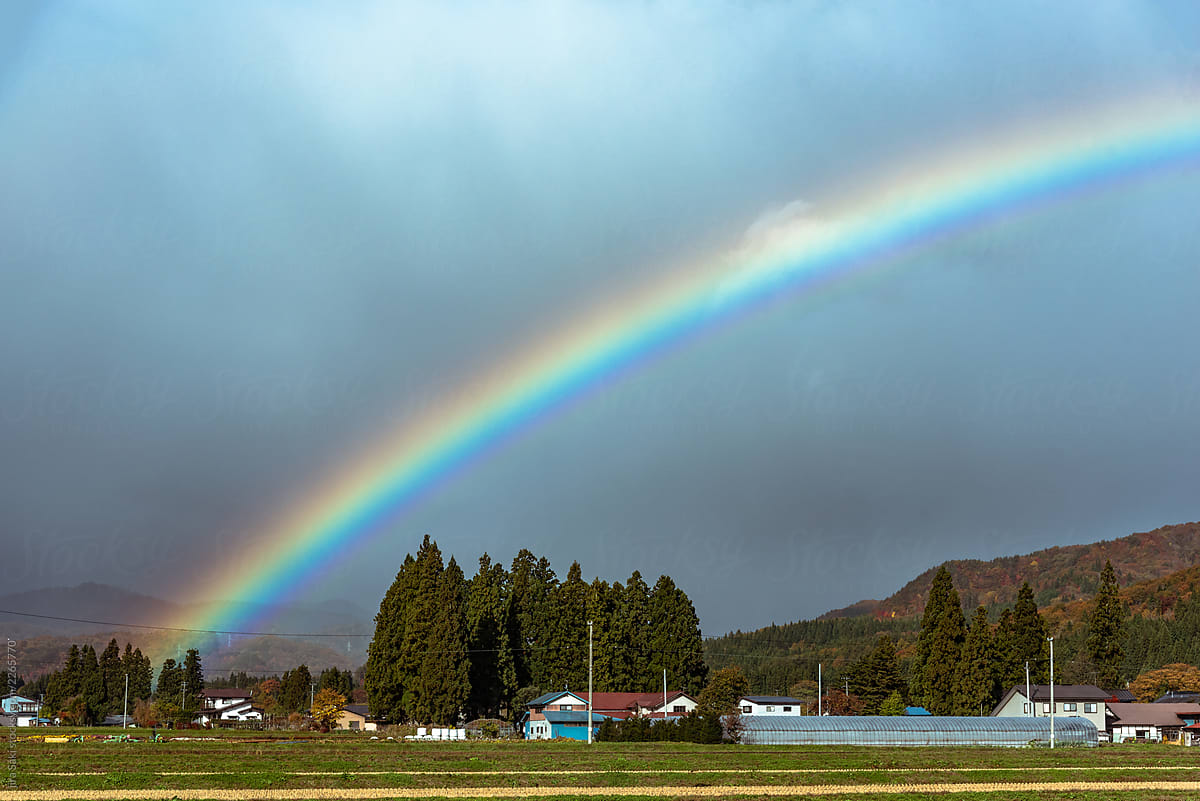 rainbow above ricefeild in Japan